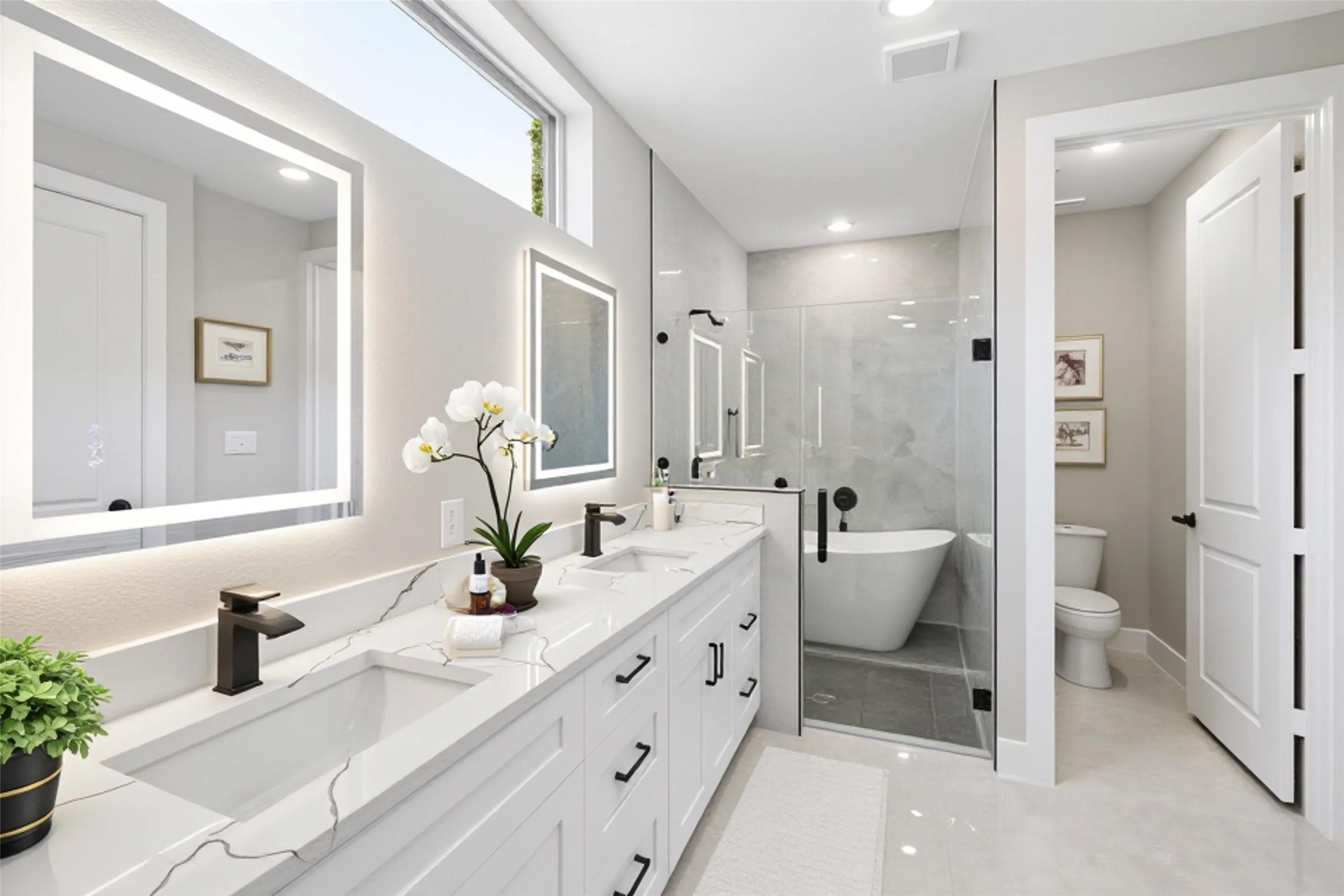 20019 Venetto St Spring Spring, TX 77388 - Photo 16 of 35 a bathroom with double vanity sink a toilet and a mirror
