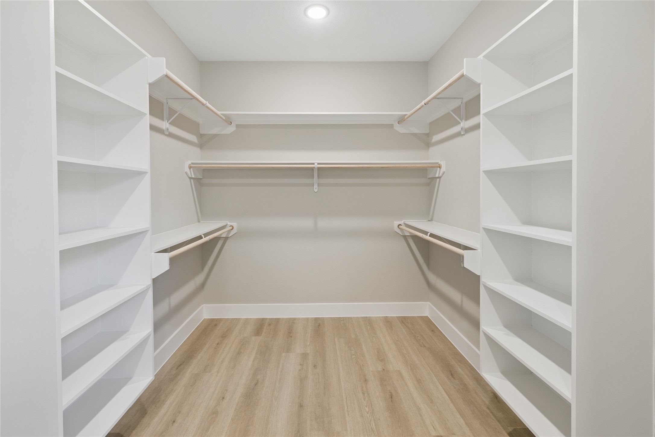 20019 Venetto St Spring Spring, TX 77388 - Photo 17 of 35 a view of walk in closet with empty racks