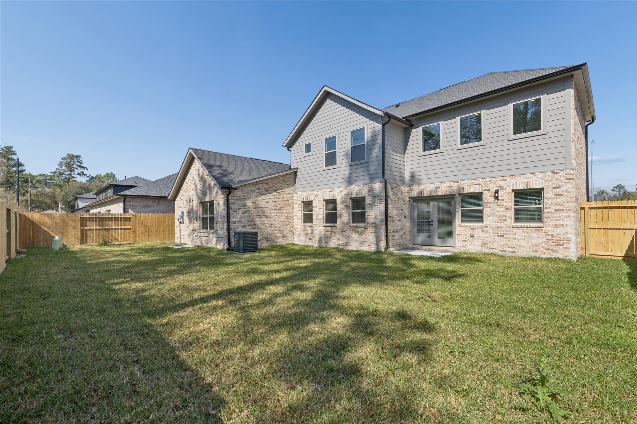 20019 Venetto St Spring Spring, TX 77388 - Photo 27 of 35 a big house with a big yard and large trees