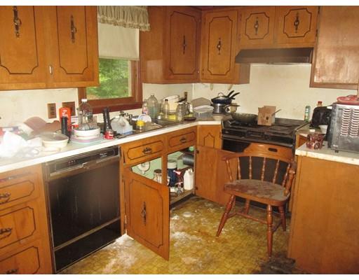 17 Lower Gore Road Webster, MA 01570 - Photo 4 of 11 a kitchen with stainless steel appliances granite countertop a sink stove and cabinets