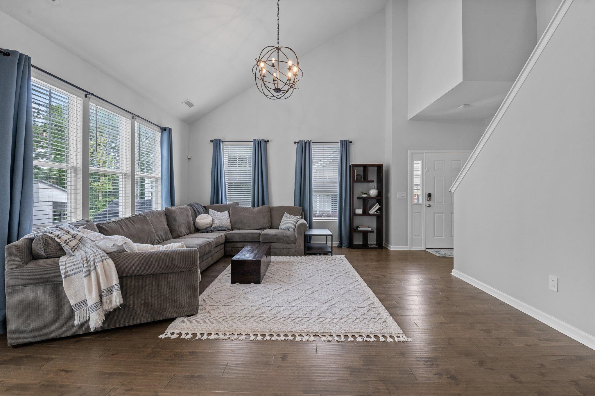 7718 Cape Charles Drive Raleigh, NC 27617 - Photo 12 of 43 a living room with furniture and a large window
