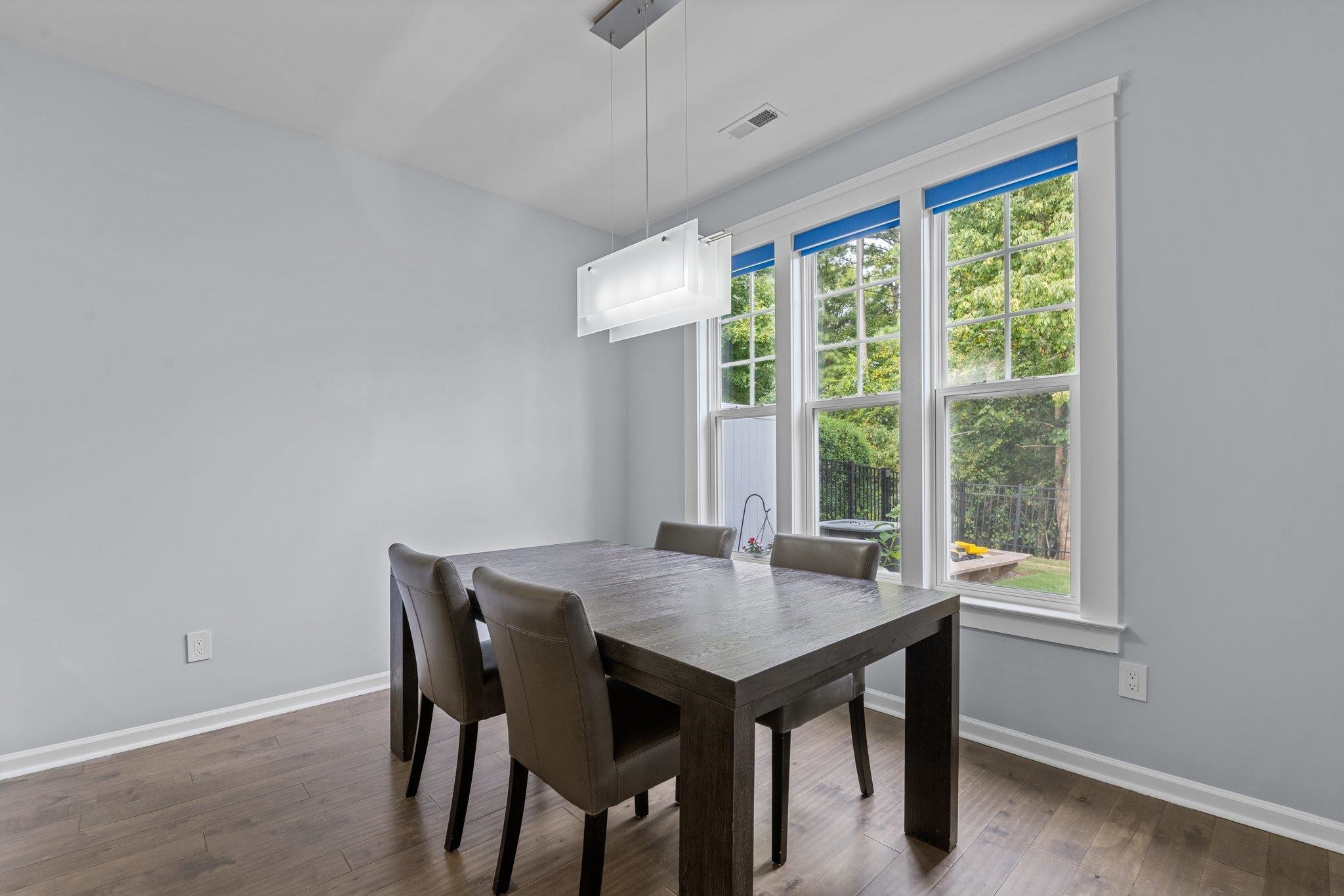7718 Cape Charles Drive Raleigh, NC 27617 - Photo 14 of 43 a view of a dining room with a table and chairs