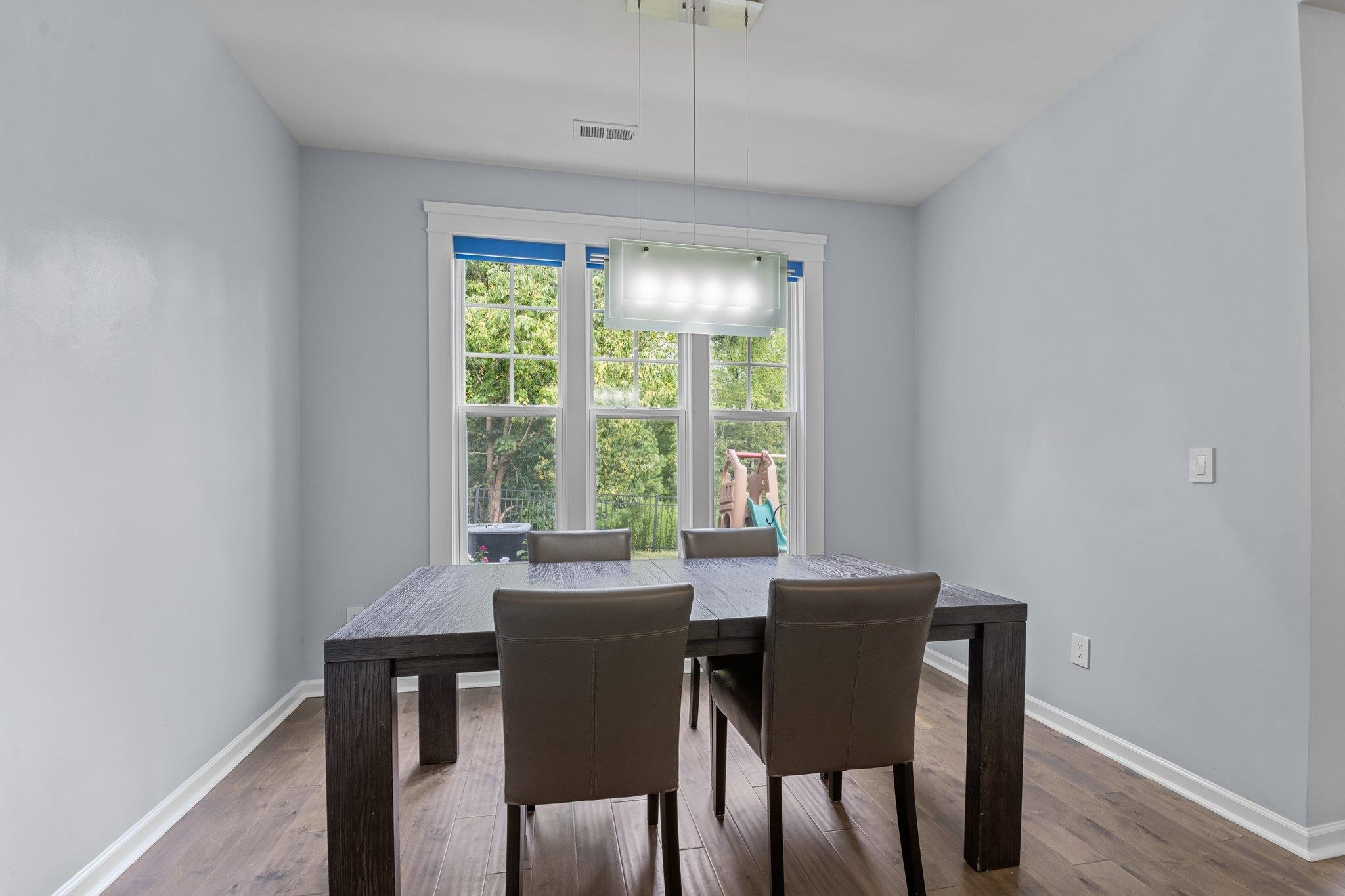 7718 Cape Charles Drive Raleigh, NC 27617 - Photo 15 of 43 a view of a dining room with furniture window and outside view