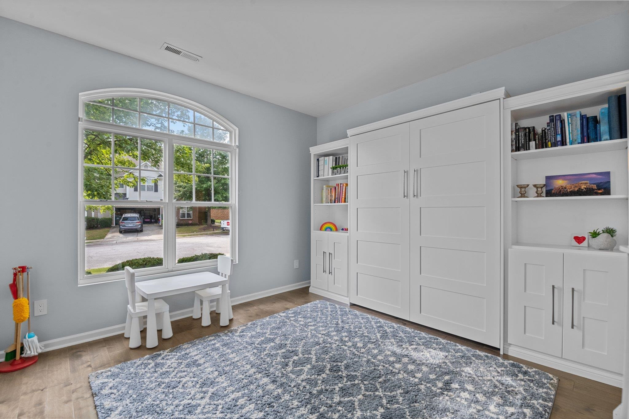 7718 Cape Charles Drive Raleigh, NC 27617 - Photo 16 of 43 a living room with furniture and a window