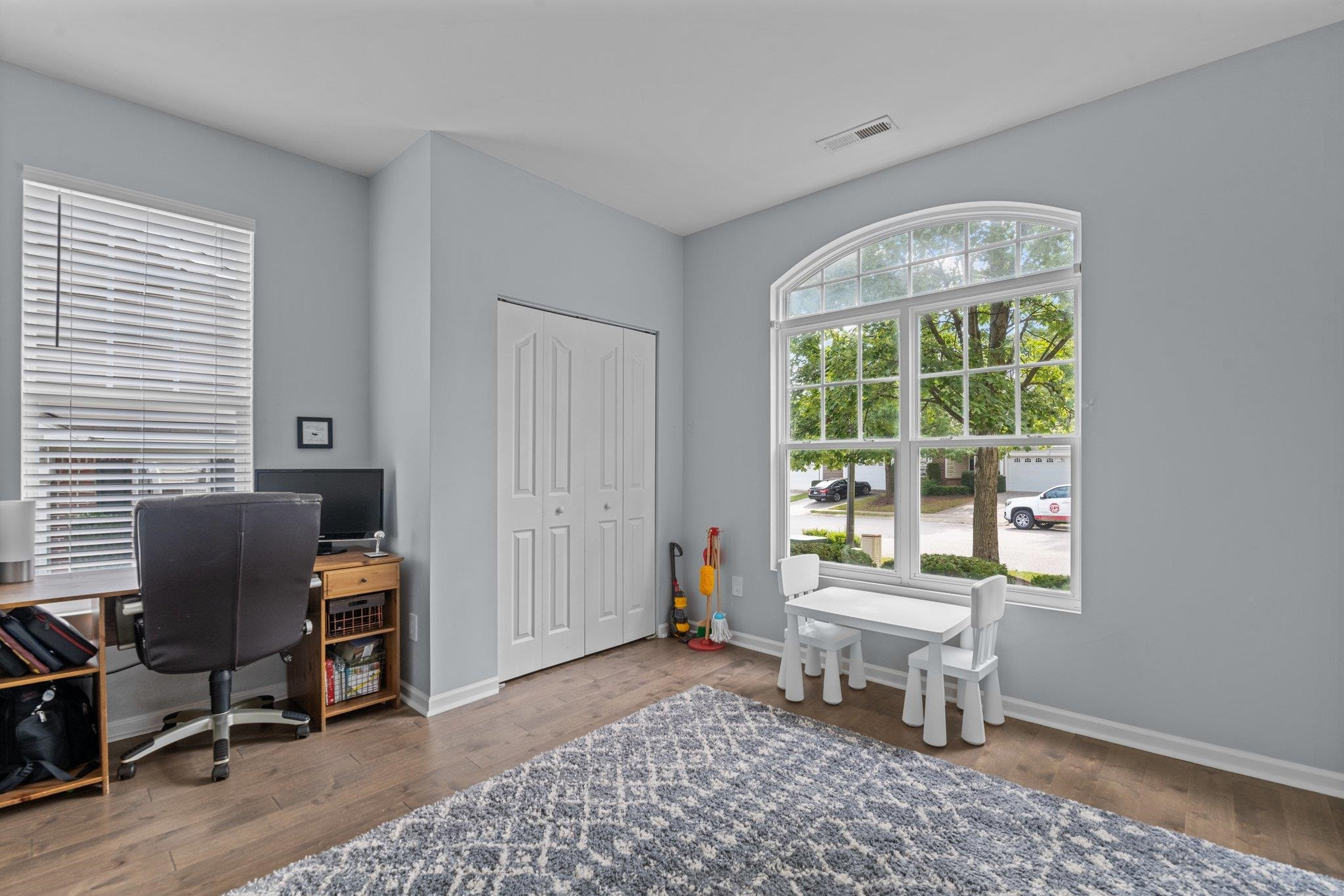7718 Cape Charles Drive Raleigh, NC 27617 - Photo 17 of 43 a living room with furniture and a window