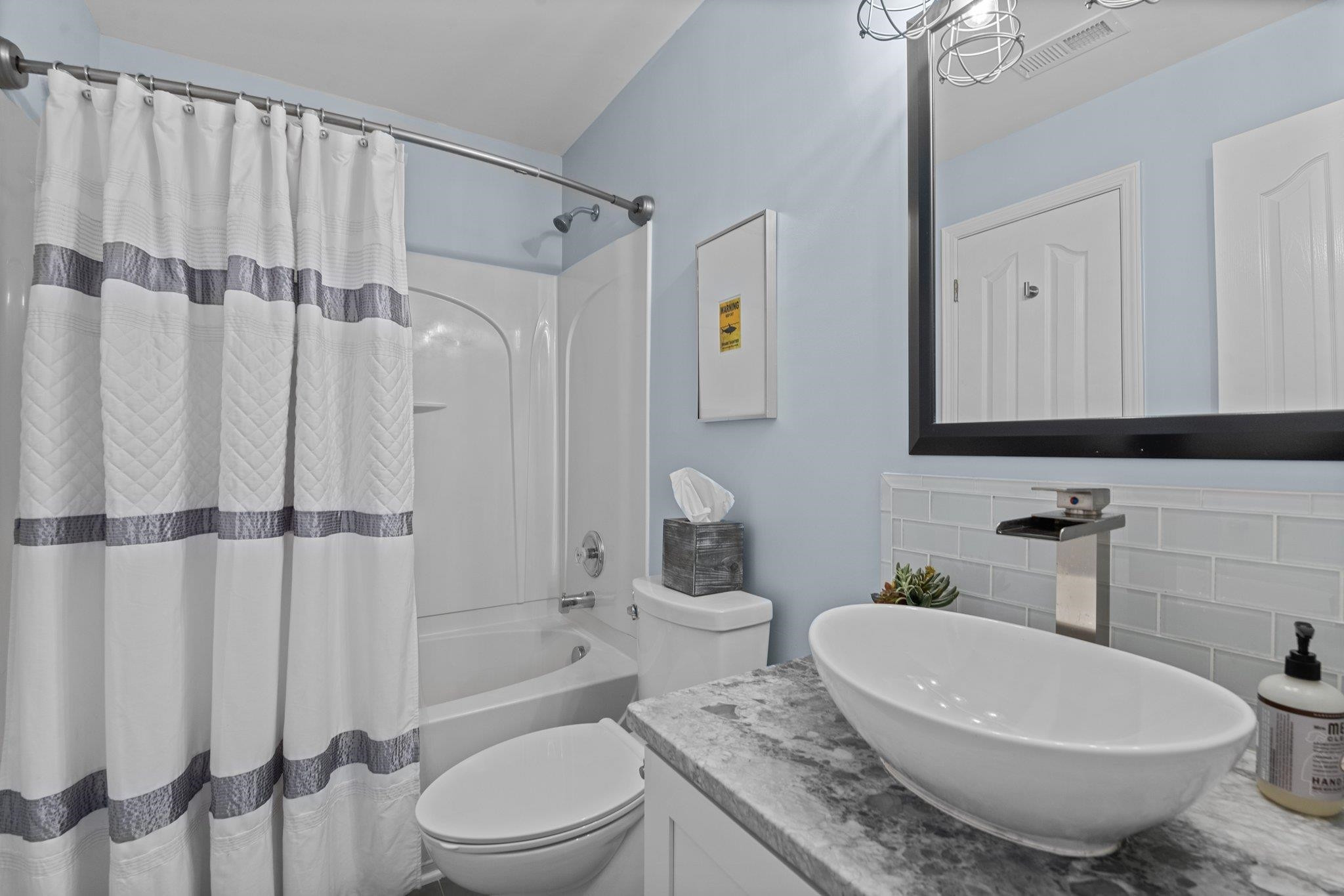 7718 Cape Charles Drive Raleigh, NC 27617 - Photo 18 of 43 a bathroom with a granite countertop sink toilet and shower