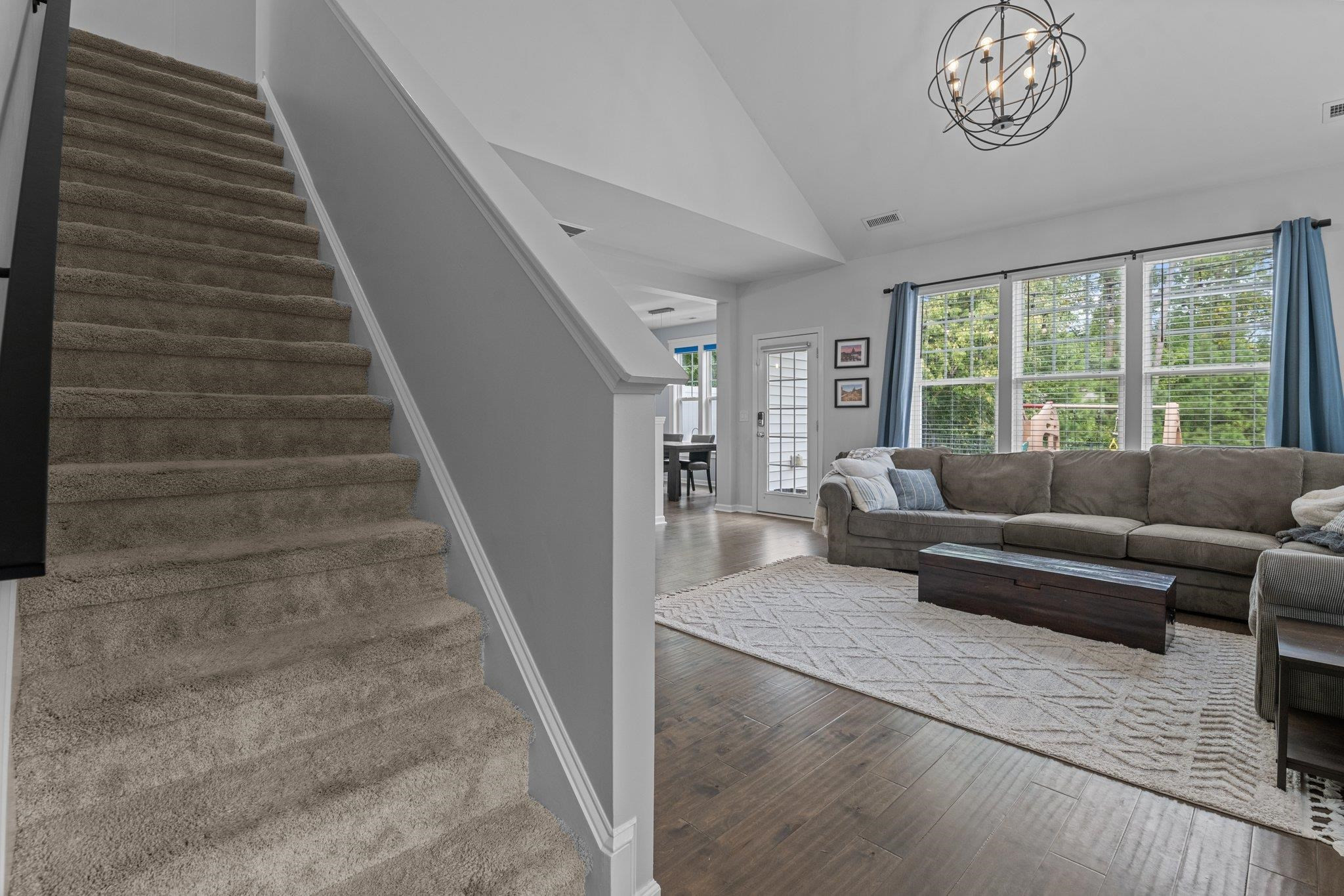 7718 Cape Charles Drive Raleigh, NC 27617 - Photo 19 of 43 a living room with furniture and a large window