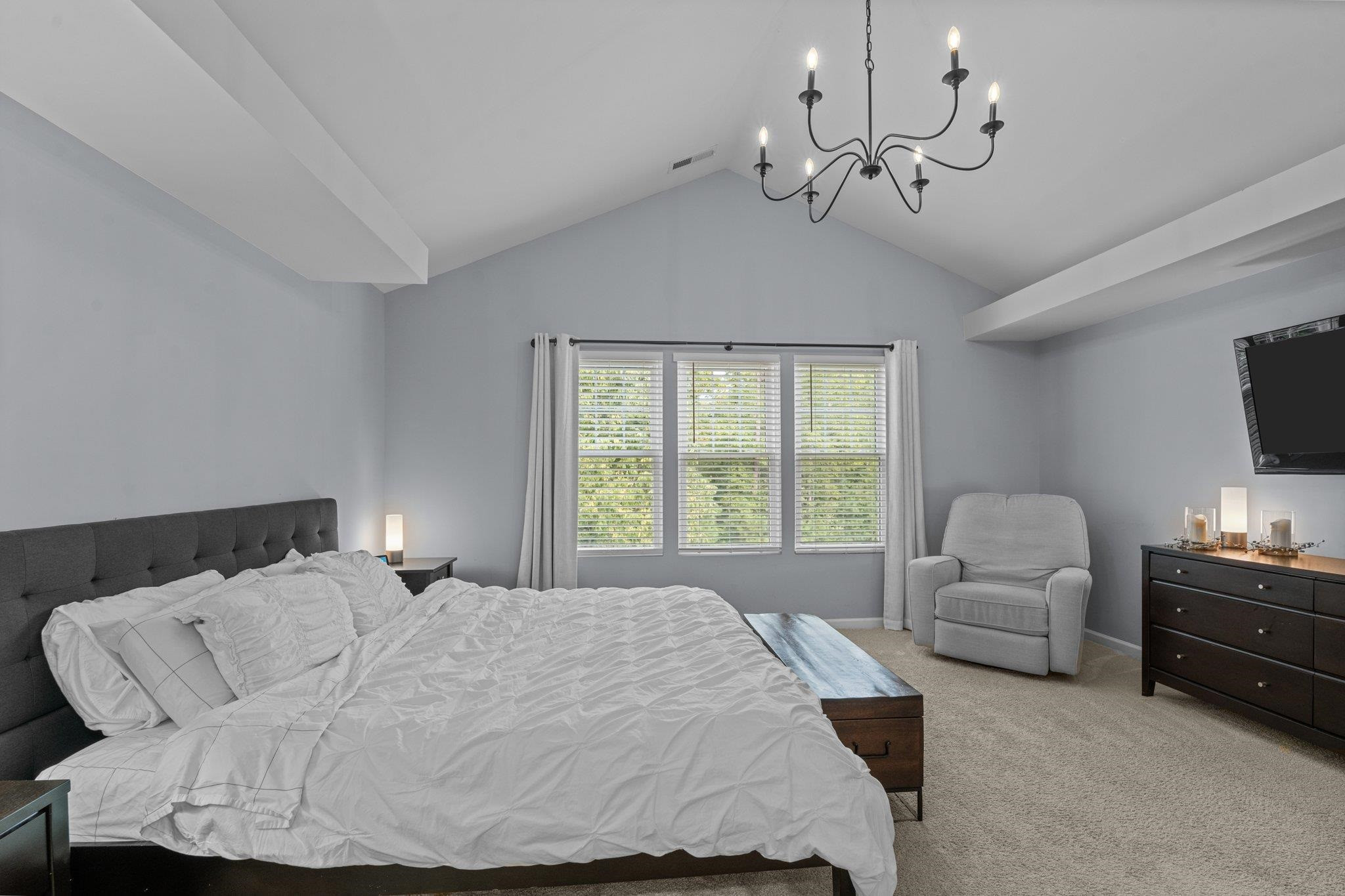 7718 Cape Charles Drive Raleigh, NC 27617 - Photo 22 of 43 a spacious bedroom with a bed and window