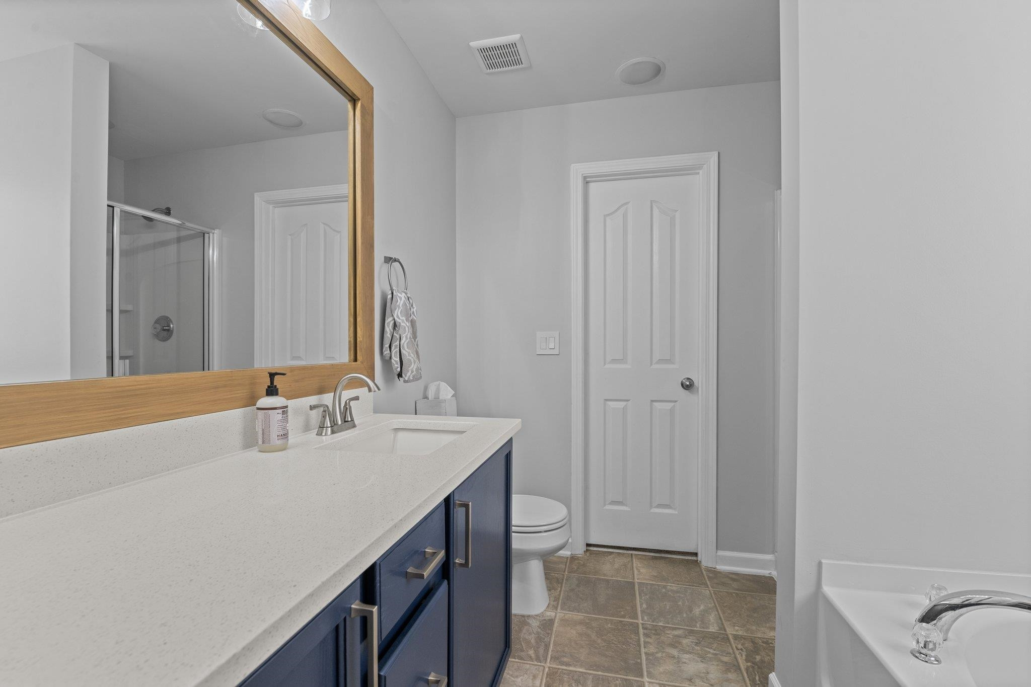 7718 Cape Charles Drive Raleigh, NC 27617 - Photo 23 of 43 a bathroom with a sink and a mirror