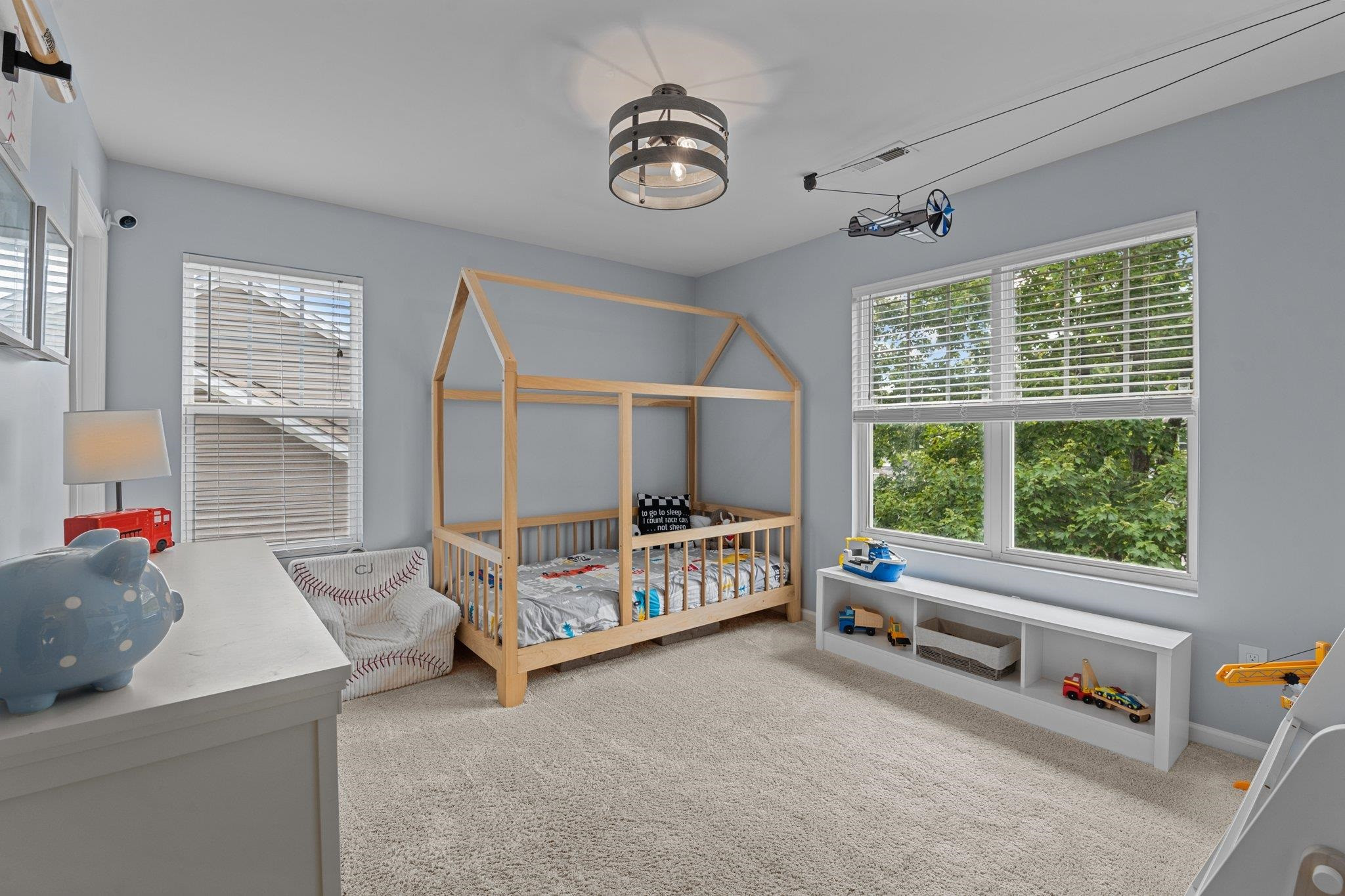 7718 Cape Charles Drive Raleigh, NC 27617 - Photo 27 of 43 a bedroom with furniture and a large window