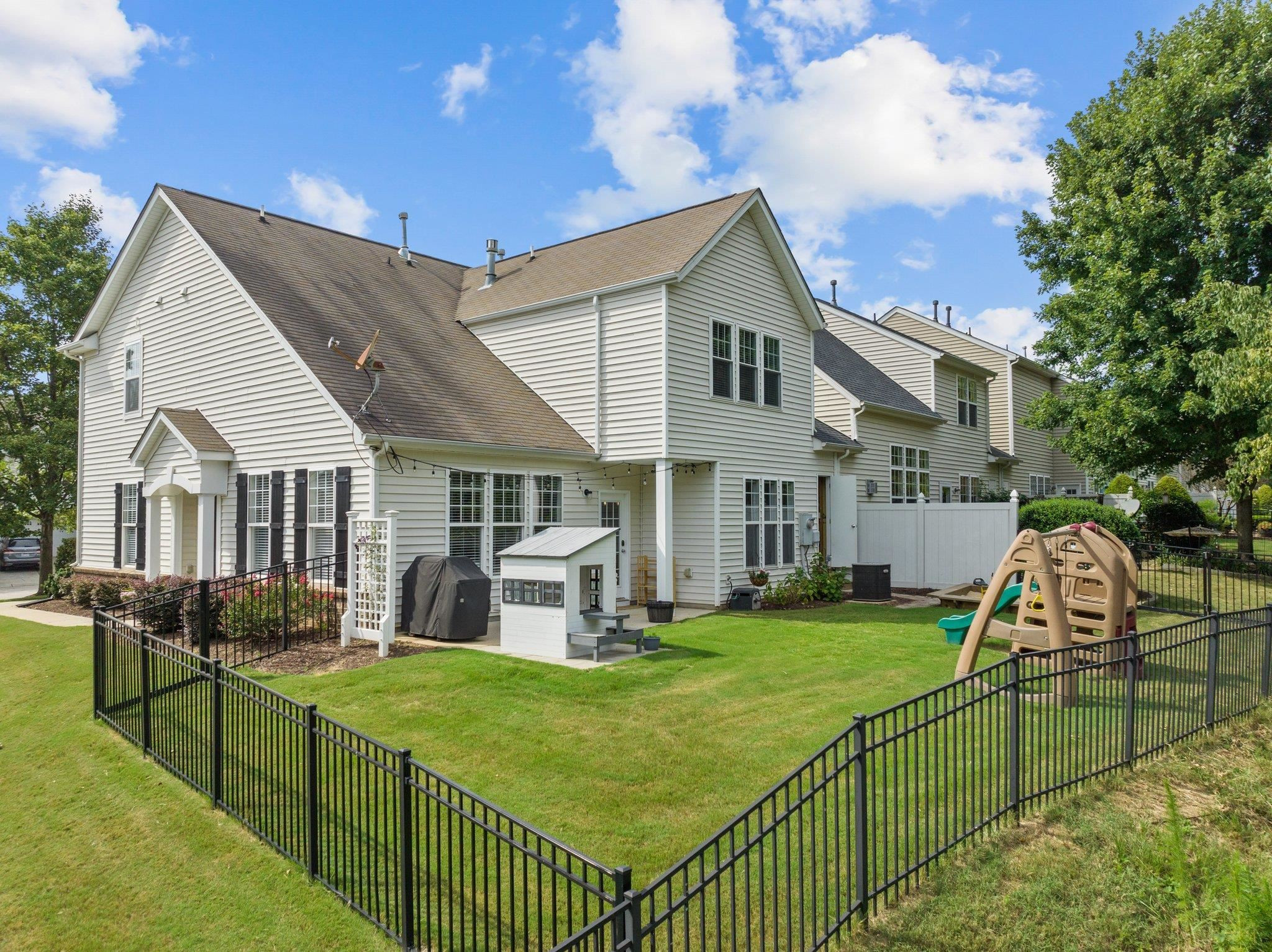 7718 Cape Charles Drive Raleigh, NC 27617 - Photo 30 of 43 a front view of house with yard and green space