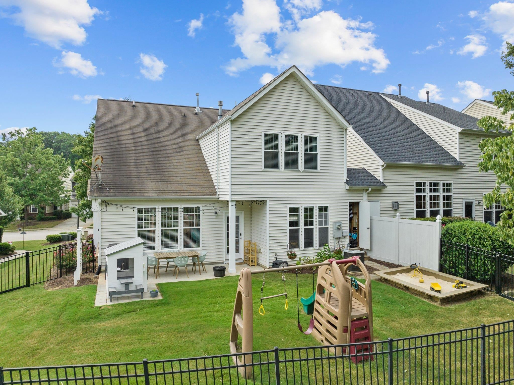 7718 Cape Charles Drive Raleigh, NC 27617 - Photo 31 of 43 a view of a house with a yard