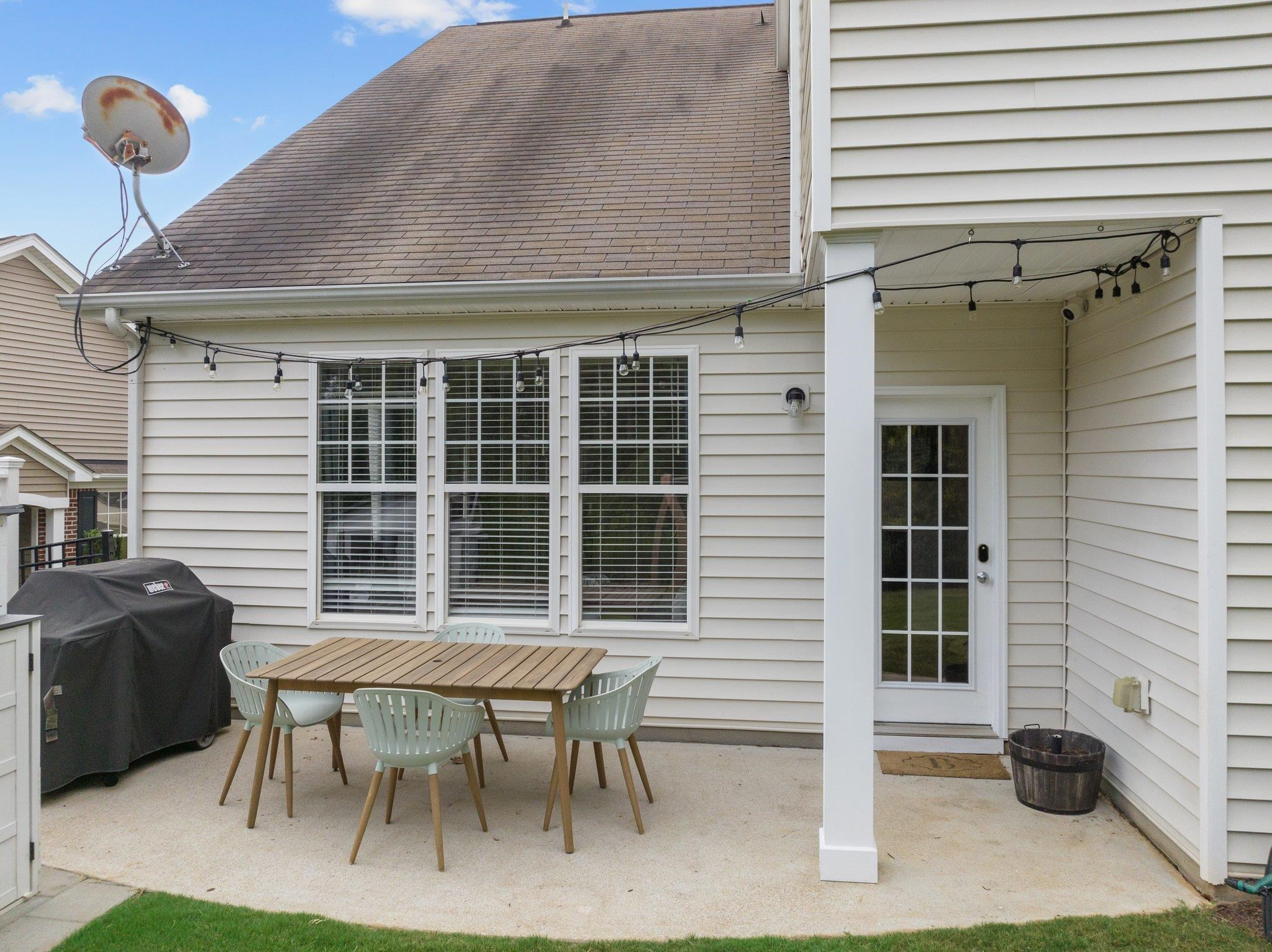 7718 Cape Charles Drive Raleigh, NC 27617 - Photo 34 of 43 a backyard of a house with table and chairs