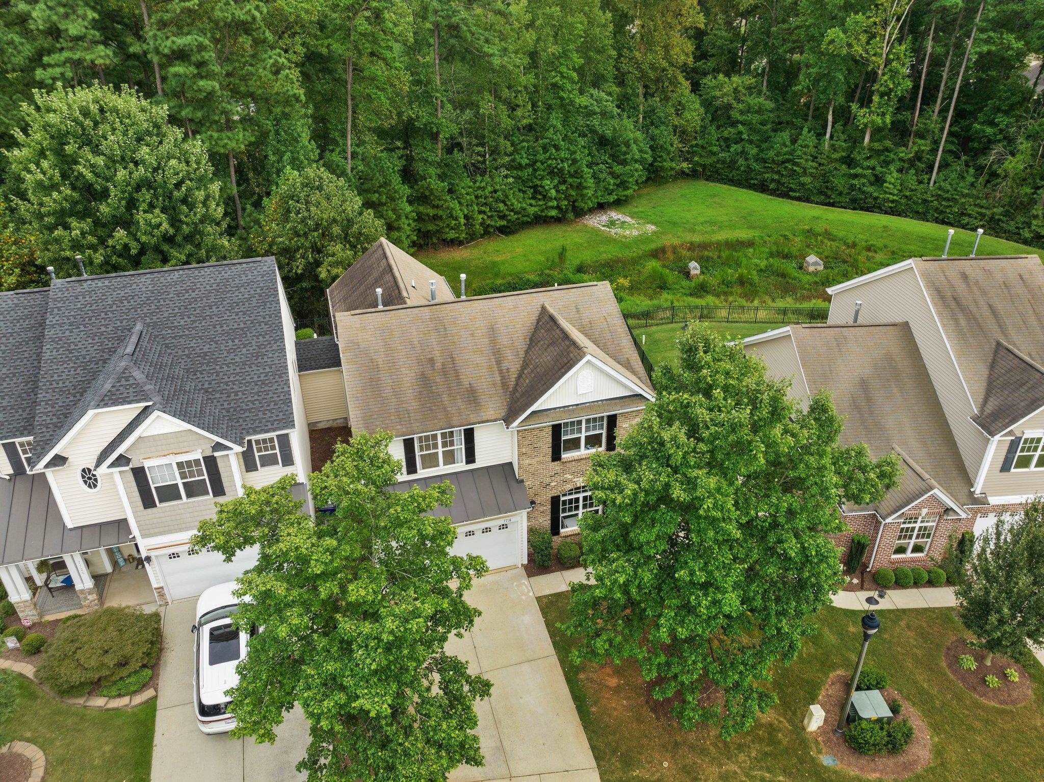 7718 Cape Charles Drive Raleigh, NC 27617 - Photo 42 of 43 an aerial view of a house with garden space and a street view