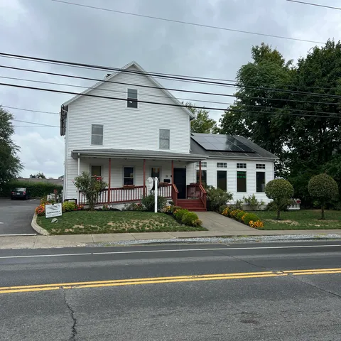 a view of a house and a garden