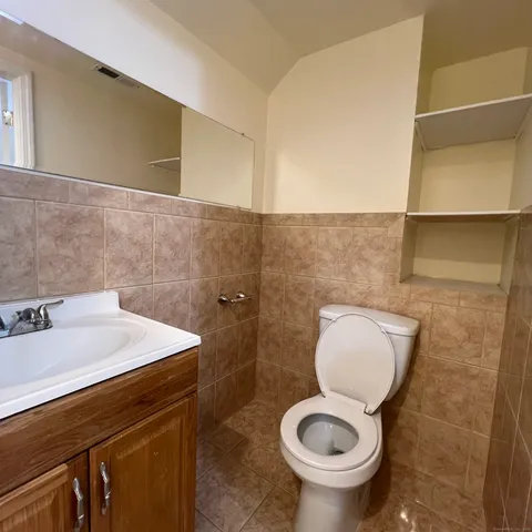 a bathroom with a tub and a sink