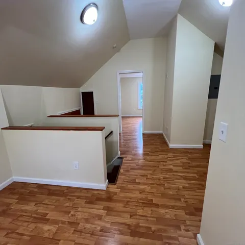 a view of a livingroom with wooden floor