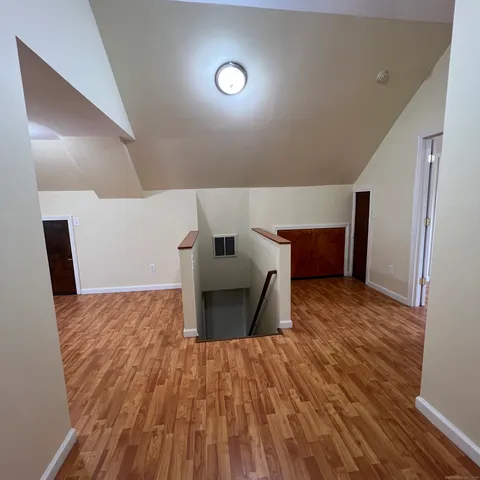 a view of room with wooden floor and chair