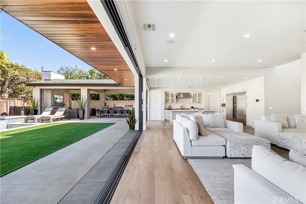 660 Kings Road Newport Beach, CA 92663 - Photo 3 of 41 a view of living room filled with furniture and garden