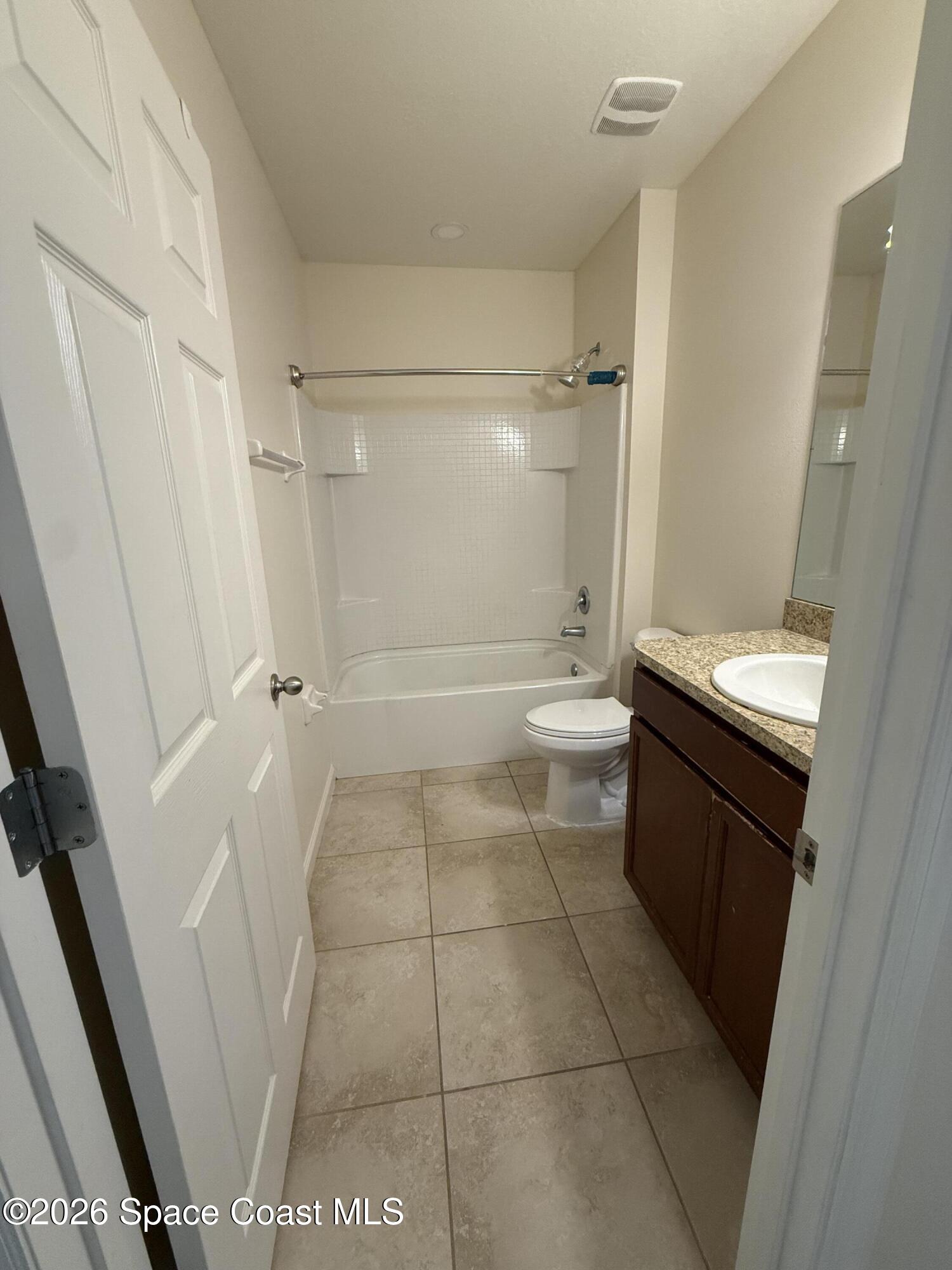 1070 Swiss Pointe Lane Rockledge, FL 32955 - Photo 14 of 18 a bathroom with a sink a toilet and a shower
