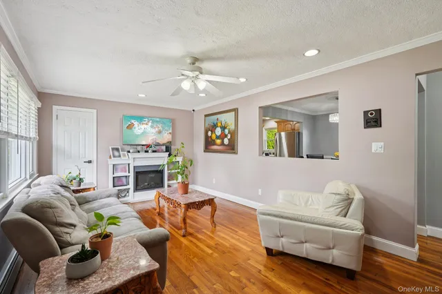 a living room with fireplace furniture and a wooden floor