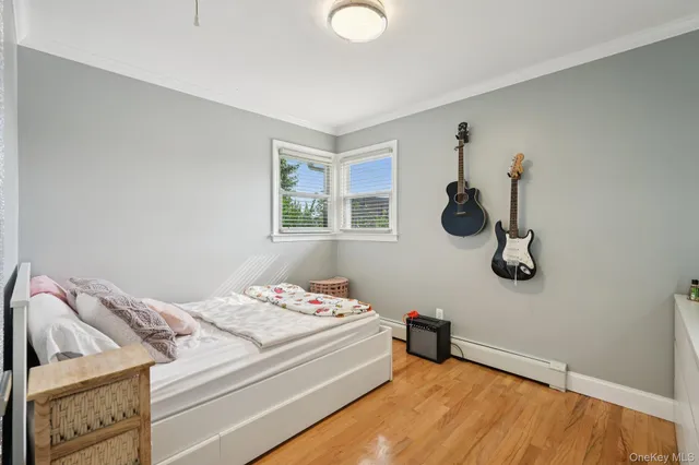 a bedroom with a bed and cabinets