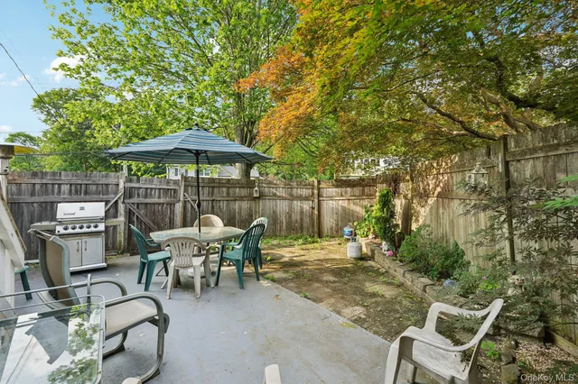 a patio with table and chairs