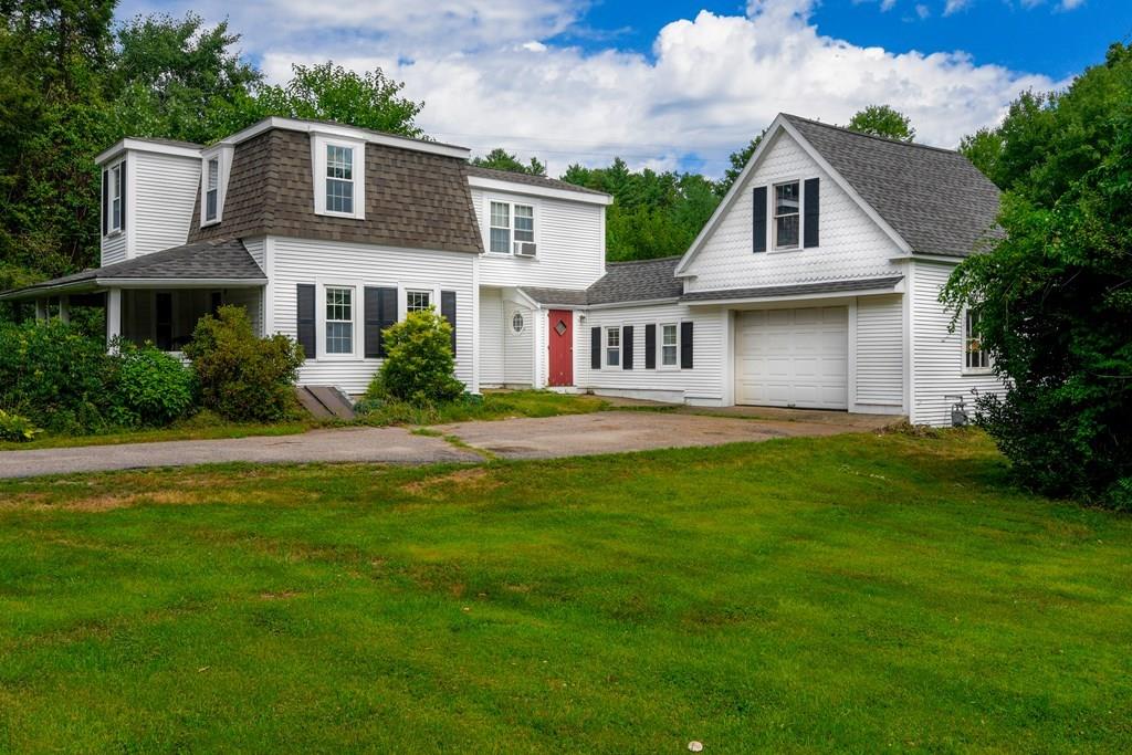 366 Spring Street Hanson, MA 02341 - Photo 1 of 13 a front view of a house with a garden