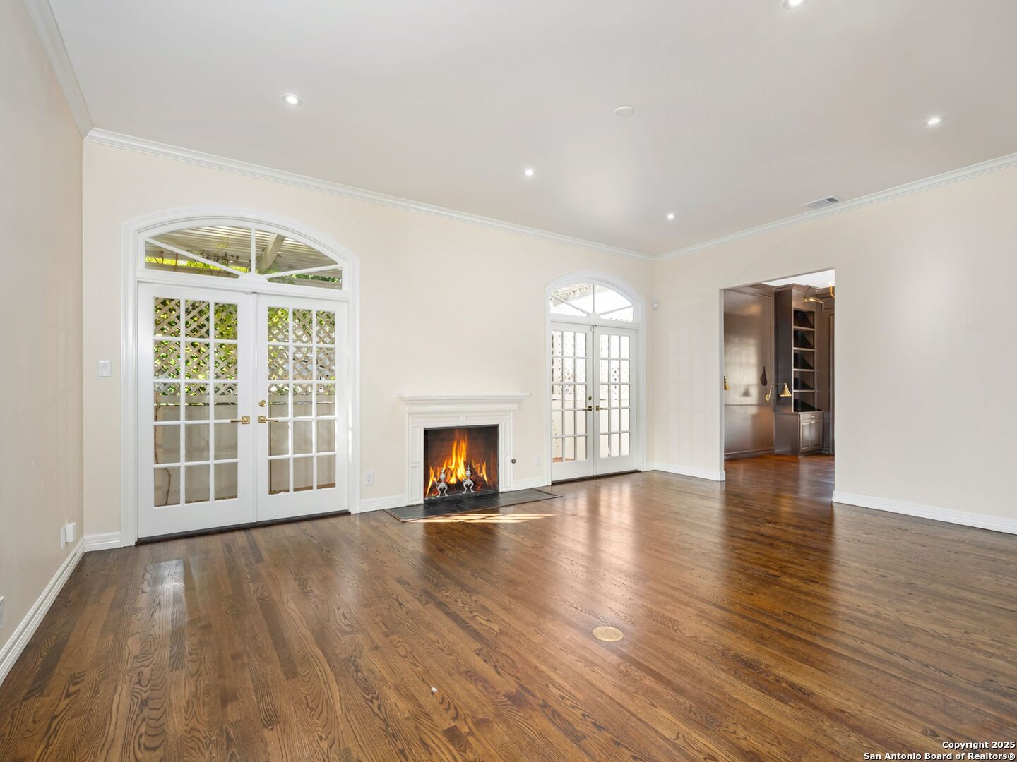 160 Burr Road San Antonio, TX 78209 - Photo 12 of 60 a view of an empty room with wooden floor and a window
