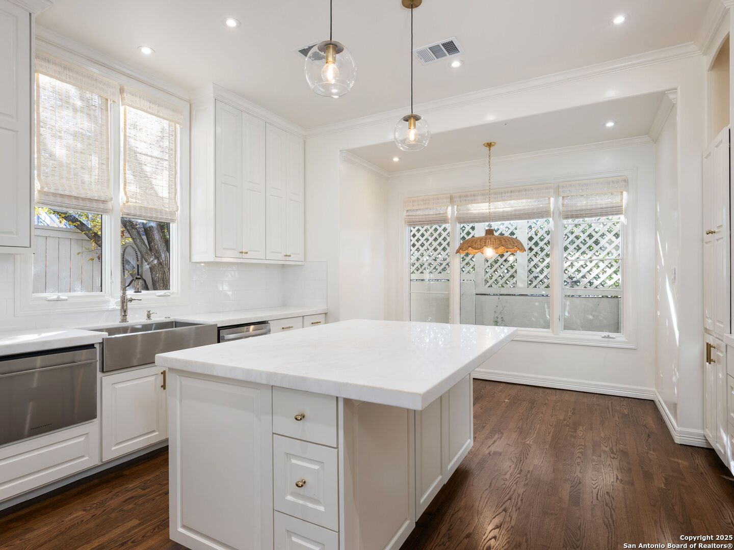 160 Burr Road San Antonio, TX 78209 - Photo 19 of 60 a kitchen with a stove a sink a window and wooden floor