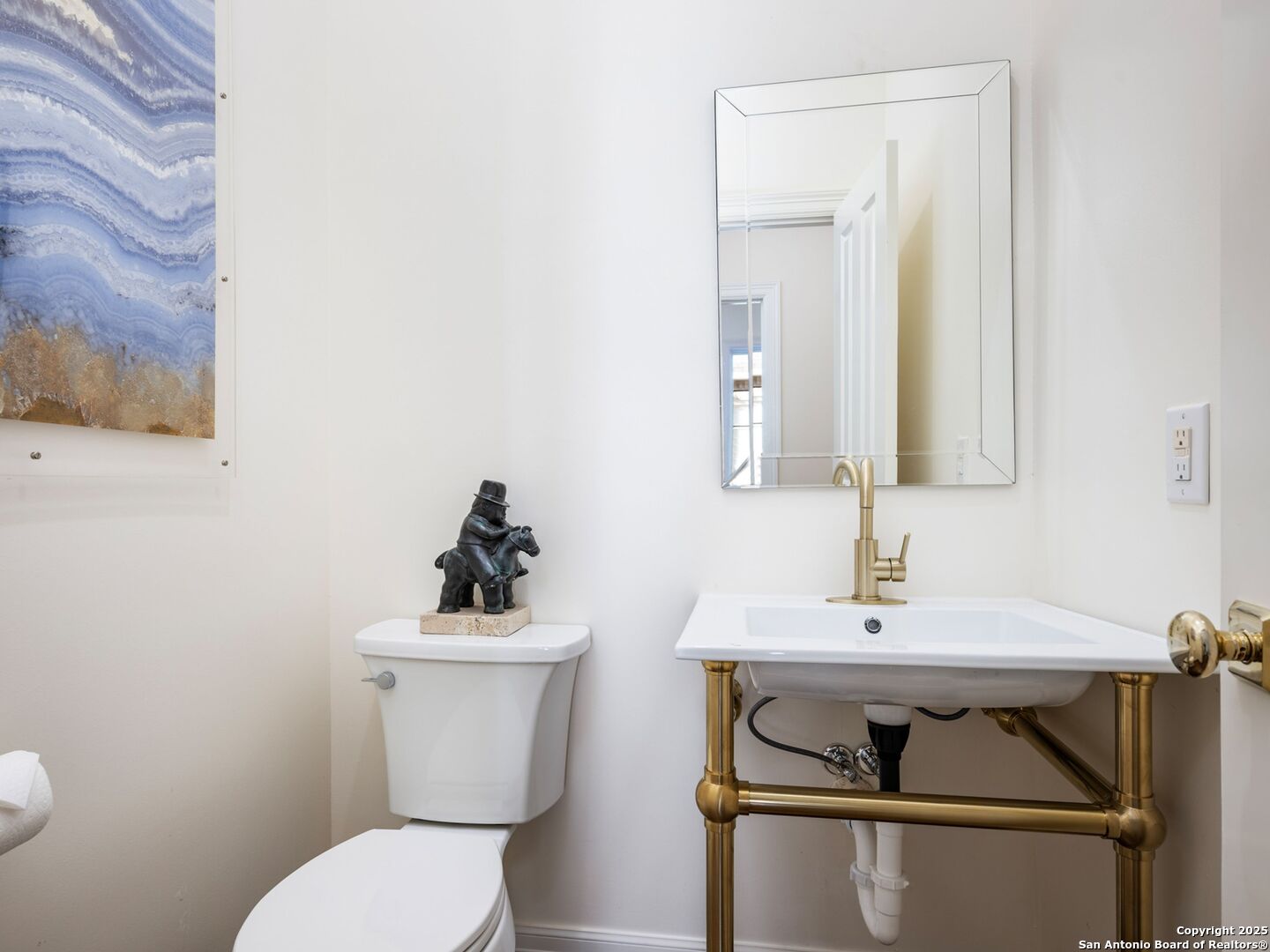 160 Burr Road San Antonio, TX 78209 - Photo 41 of 60 a bathroom with a toilet a sink and mirror