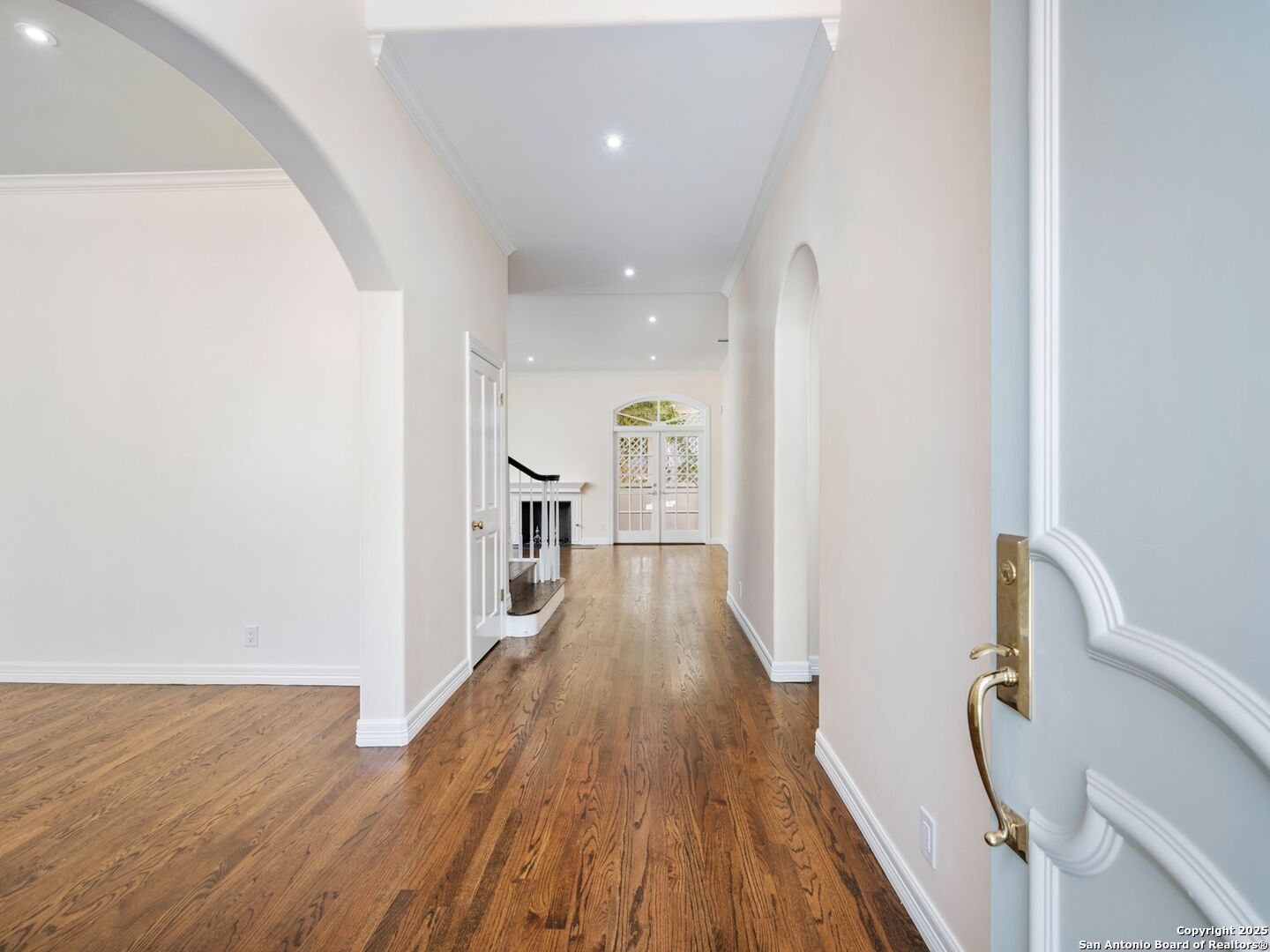 160 Burr Road San Antonio, TX 78209 - Photo 5 of 60 a view of a hallway with wooden floor and staircase