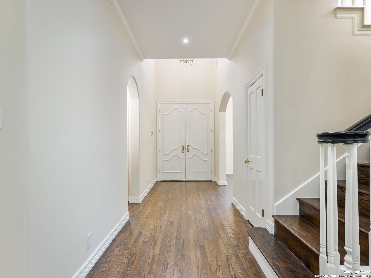 160 Burr Road San Antonio, TX 78209 - Photo 7 of 60 a view of a hallway with wooden floor and staircase