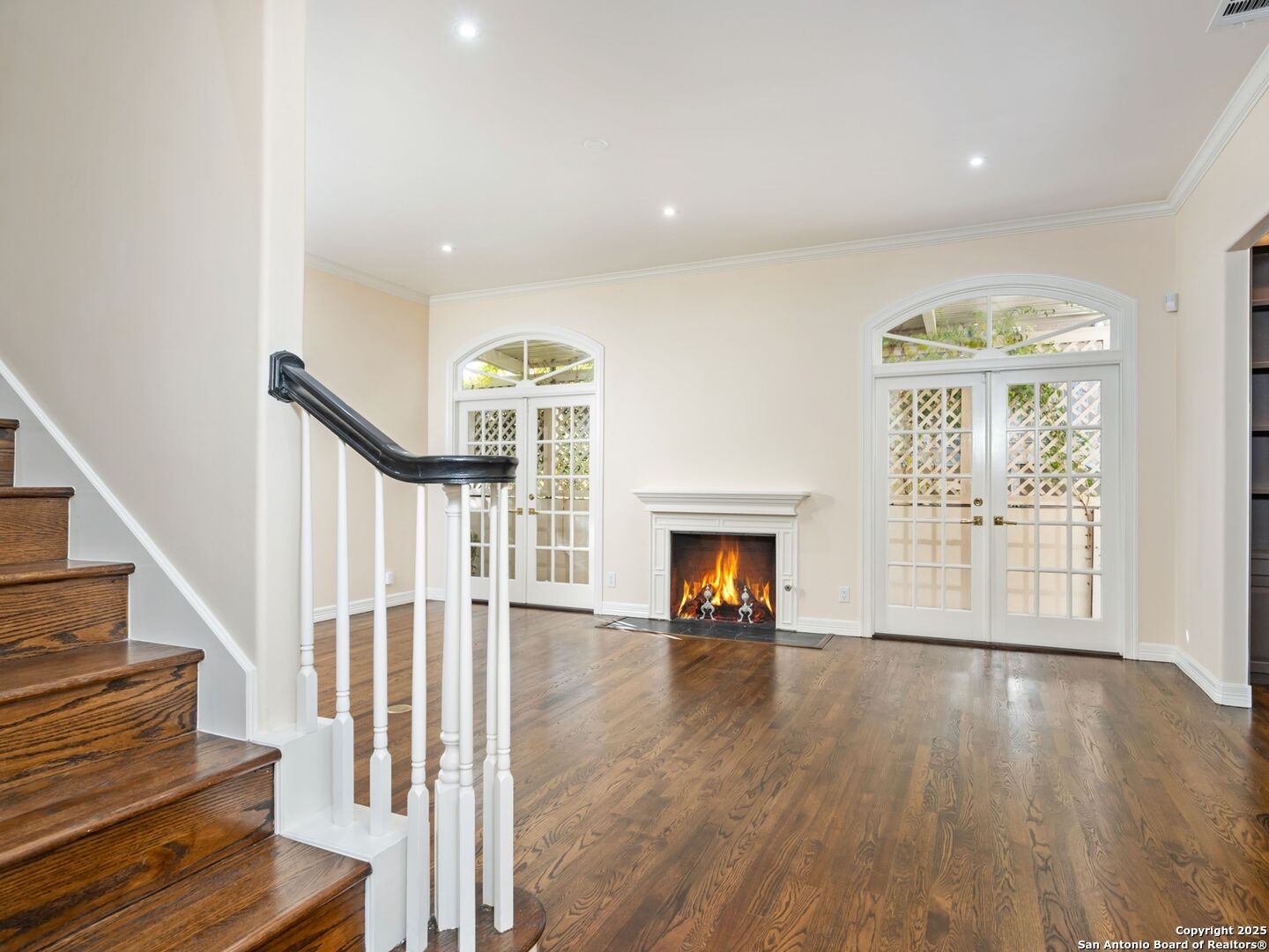 160 Burr Road San Antonio, TX 78209 - Photo 10 of 60 a view of an empty room with wooden floor fireplace and a window