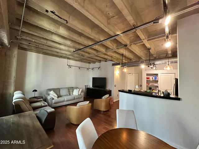 a room with pool table and windows