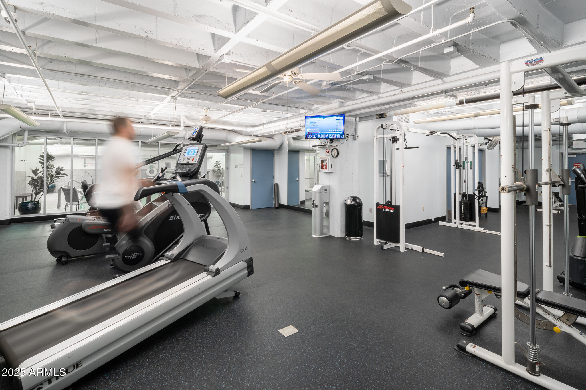 114 West Adams Street, Unit 402 Phoenix, AZ 85003 - Photo 23 of 35 a view of a room with gym equipment