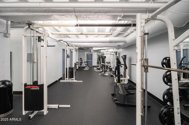 a outdoor space with lots of chairs and a shower