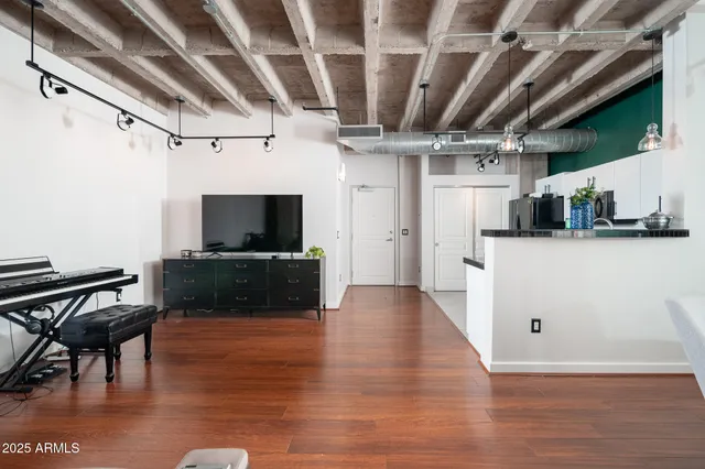 a living room with furniture and a flat screen tv