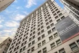 a living room with furniture lamp and window