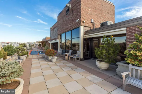 a view of a chairs and table in a patio