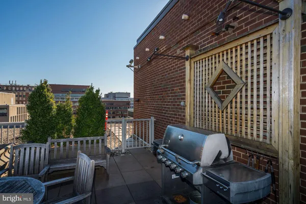 a view of a chair and table in the balcony
