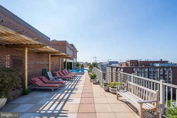 a view of a patio with a table and chairs