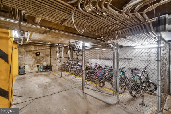 a view of a garage with wooden table and chairs