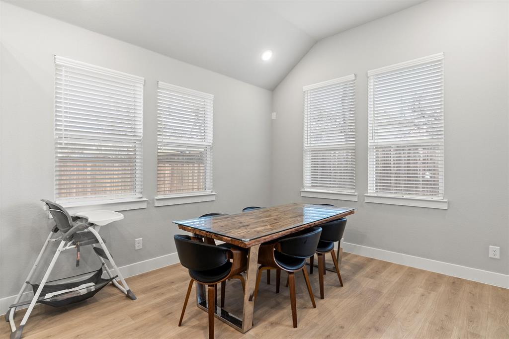 5823 Heatherwood Loop Sachse, TX 75048 - Photo 14 of 40 a view of a dining room with furniture and windows