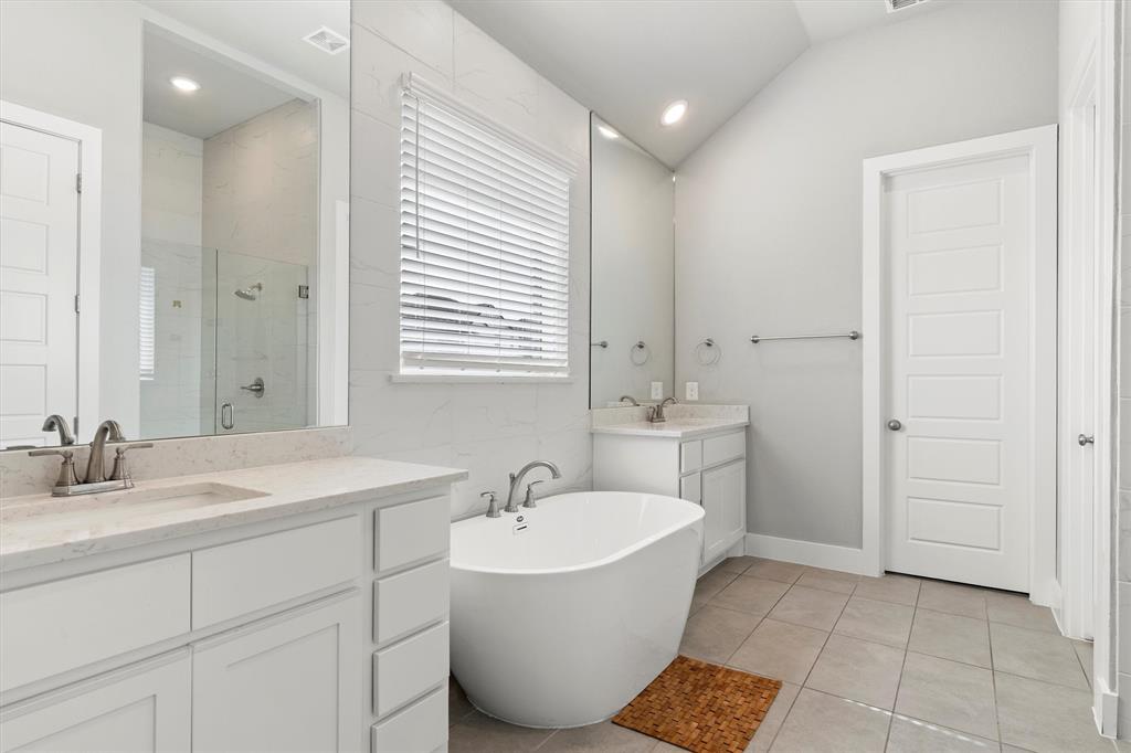 5823 Heatherwood Loop Sachse, TX 75048 - Photo 22 of 40 a bathroom with a sink and a mirror