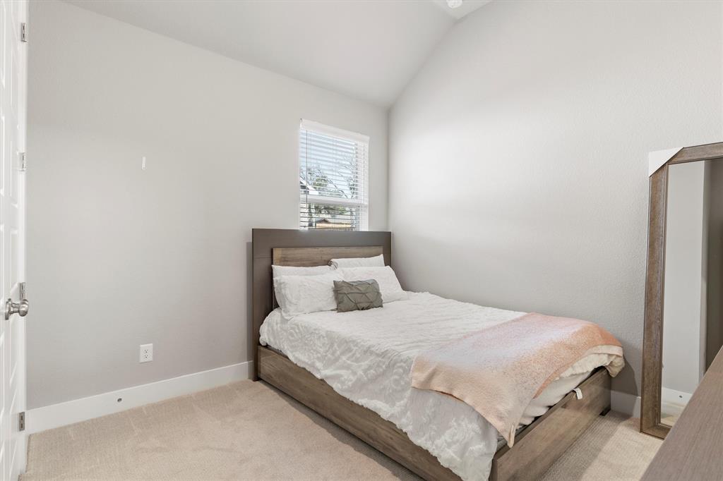 5823 Heatherwood Loop Sachse, TX 75048 - Photo 29 of 40 a bedroom with a bed and a window