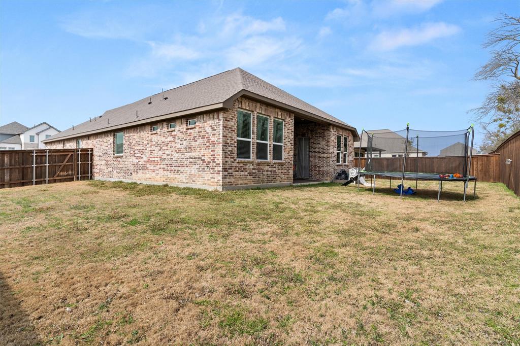 5823 Heatherwood Loop Sachse, TX 75048 - Photo 40 of 40 a view of a house with backyard and sitting area
