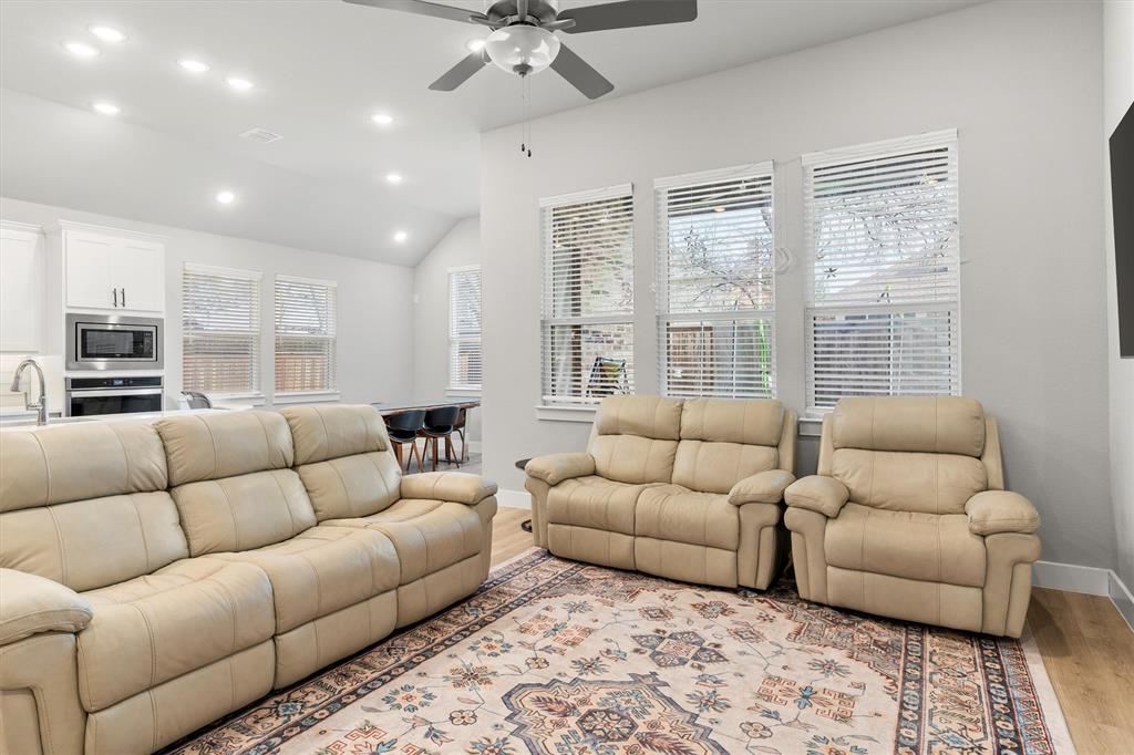 5823 Heatherwood Loop Sachse, TX 75048 - Photo 8 of 40 a living room with furniture and a large window