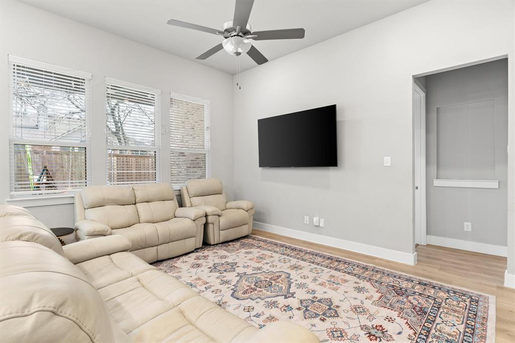 5823 Heatherwood Loop Sachse, TX 75048 - Photo 10 of 40 a living room with furniture and a flat screen tv