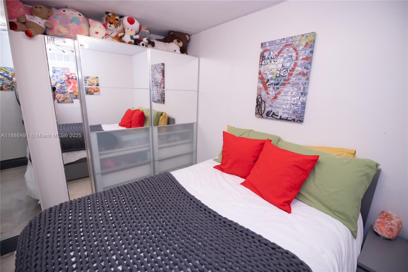 8694 Vía Reale, Unit 3 Boca Raton, FL 33496 - Photo 15 of 15 a bedroom with a bed and a couch